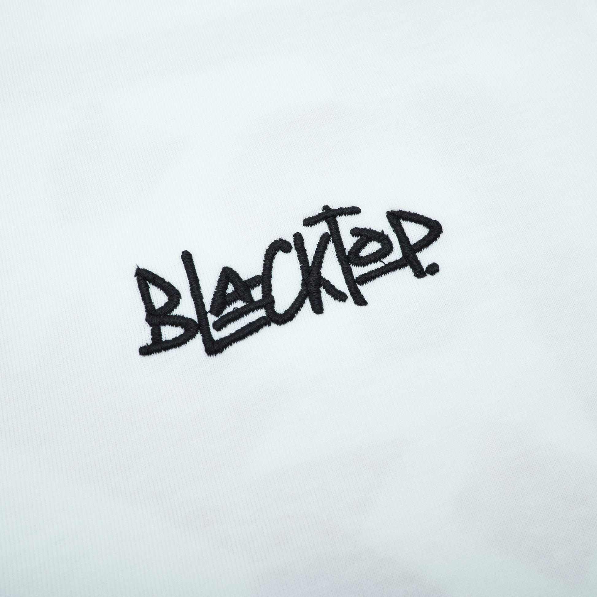Black 'BLACKTOP' text on a white background