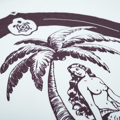 Illustration of a woman by a palm tree with a logo in the corner
