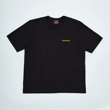 Black t-shirt with 'BLACKTOP' logo on a light gray background