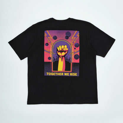 Black t-shirt with a colorful graphic of a raised fist and 'Together We Rise' text on a light gray background